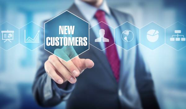 A businessman tapping a “New Customers” icon, symbolizing how a fast, reliable, and SEO-focused website can drive business growth by converting visitors into clients.