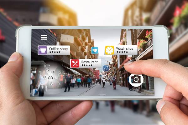 A smartphone screen showing local business listings, emphasizing the importance of local SEO and a well-optimized Google Business Profile for increased visibility.