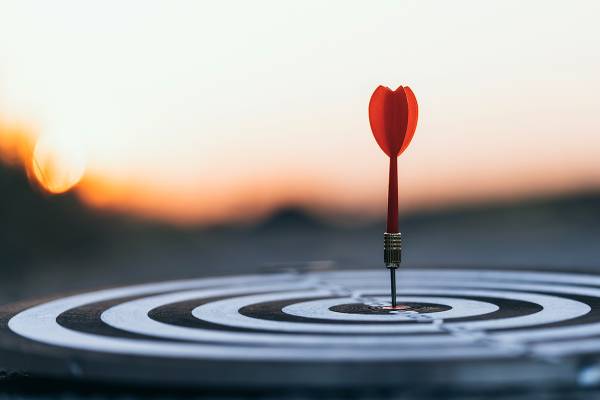 Red dart hitting the center of a bullseye, symbolizing EchoEra’s precision and results-driven digital solutions.