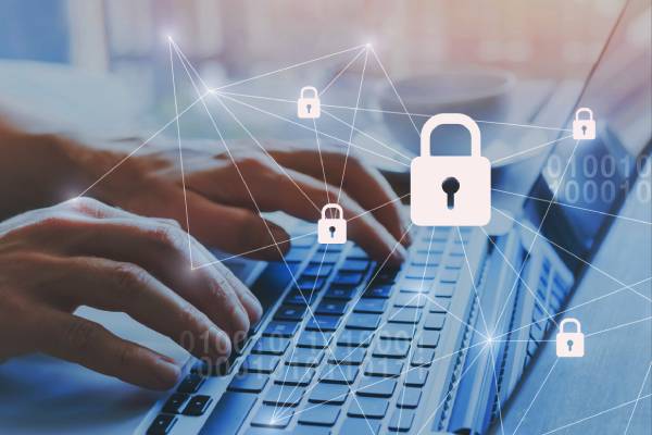 Hands typing on a laptop with overlay lock icons, representing robust digital security and worry-free website maintenance.